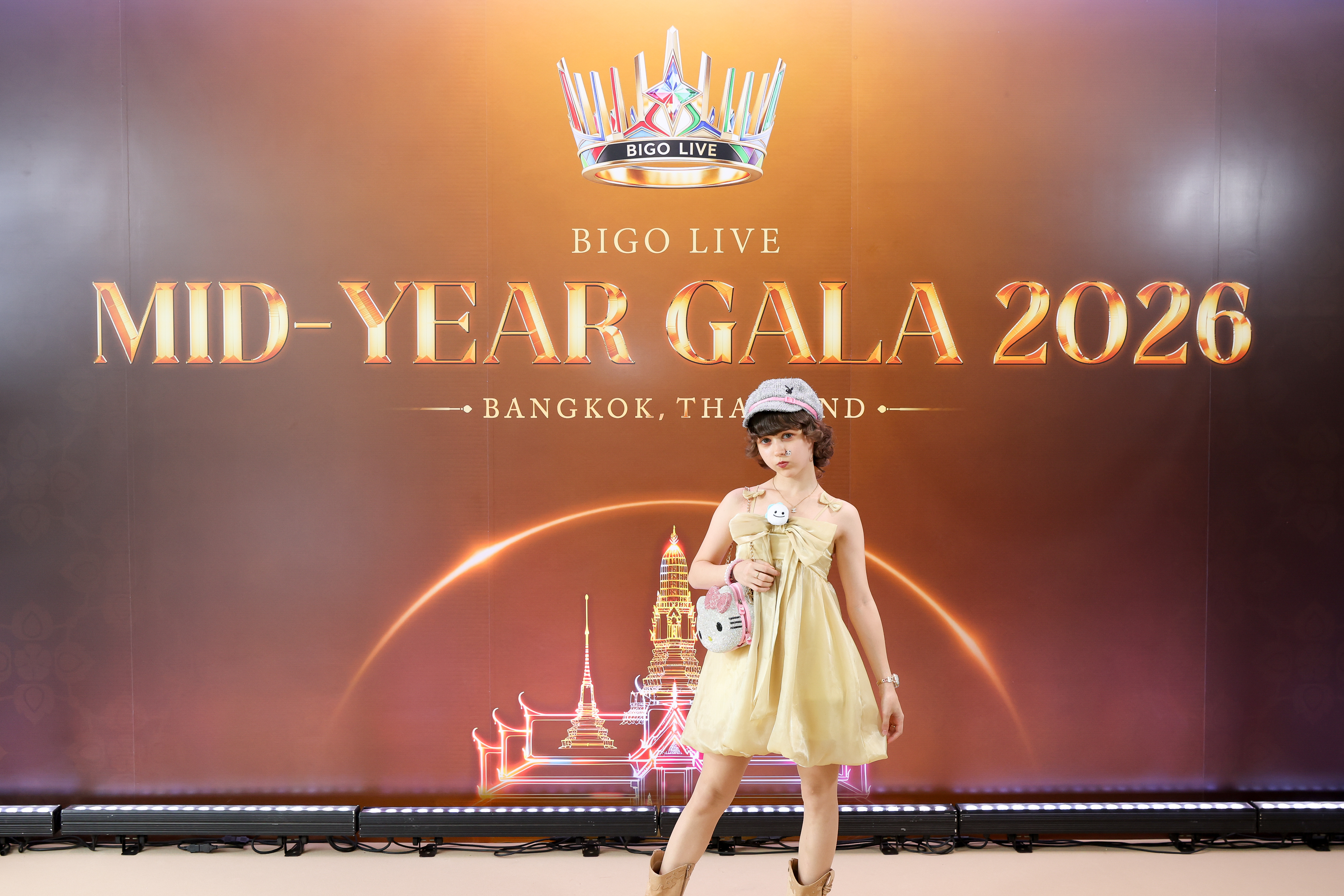 Melanie Petkins in front of the Bigo Live Mid-Year Gala 2026 backdrop in Bangkok